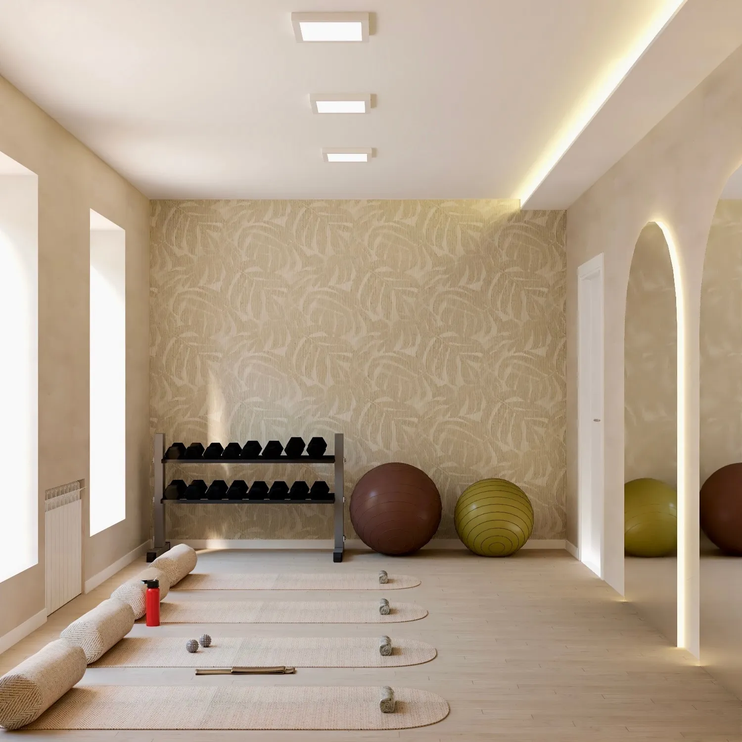 Sala de pilates con dos arcos retroiluminados y esterillas